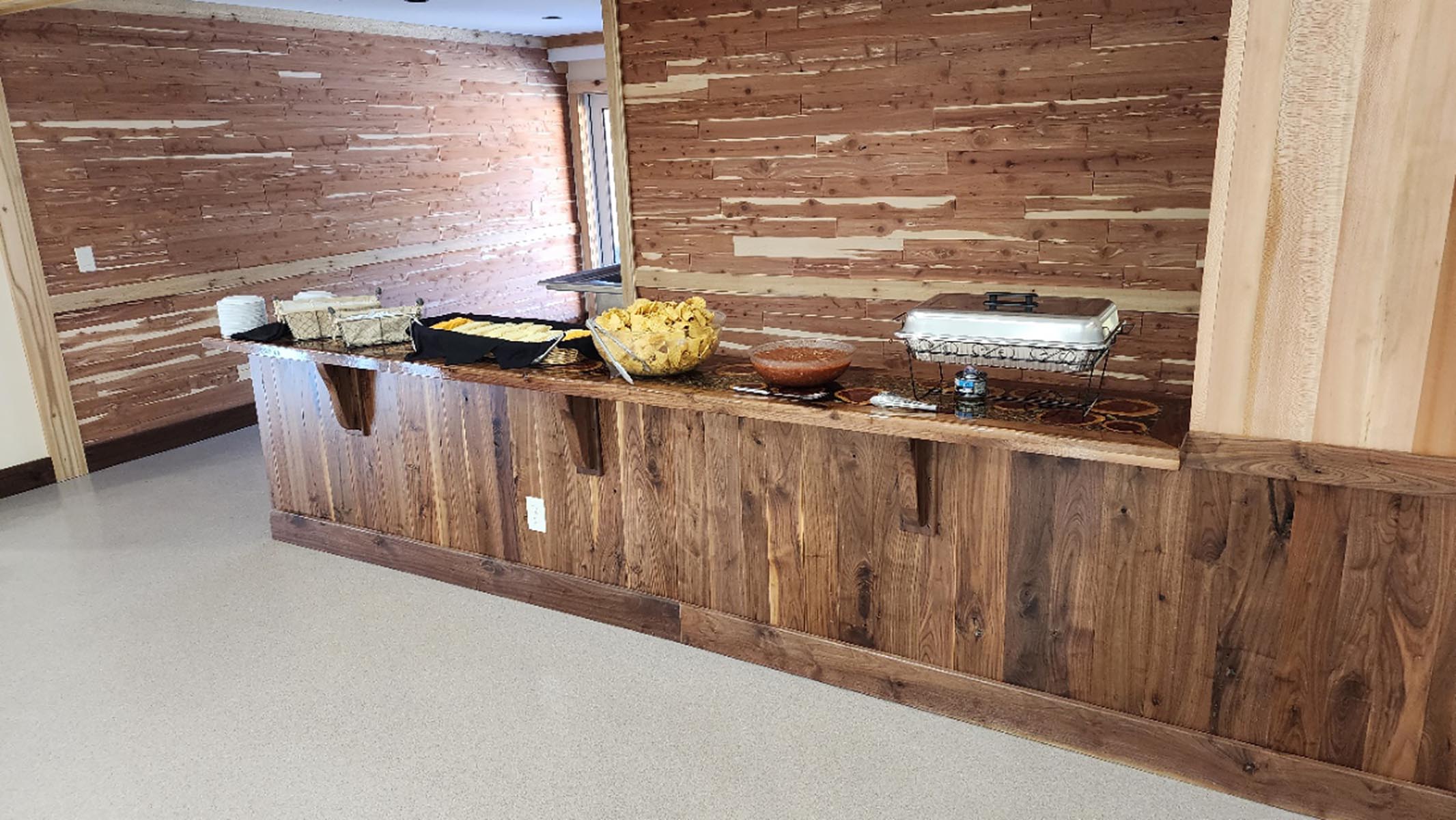 wood bar set up with catered chips and salsa