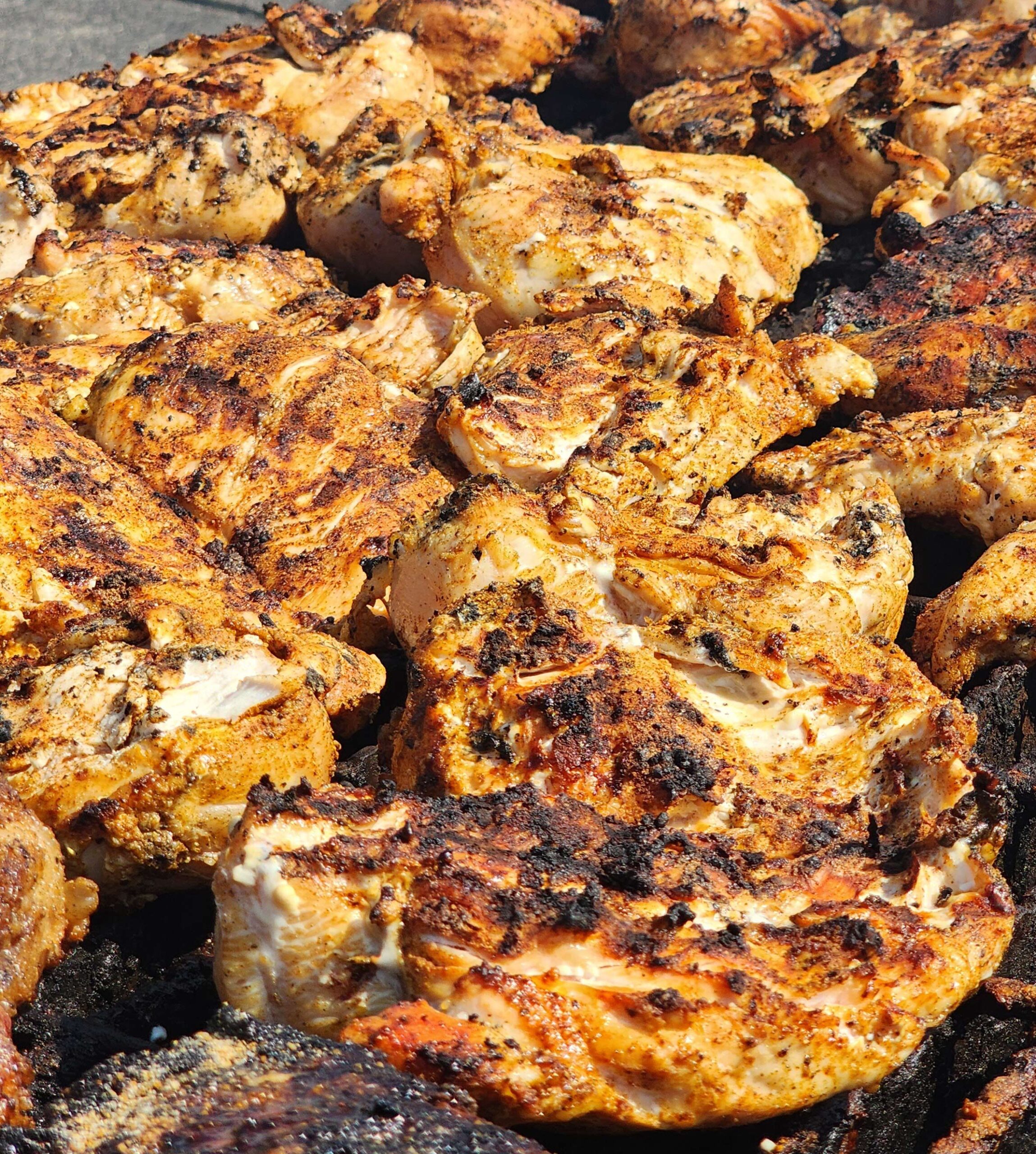 grilled chicken breasts on the grill