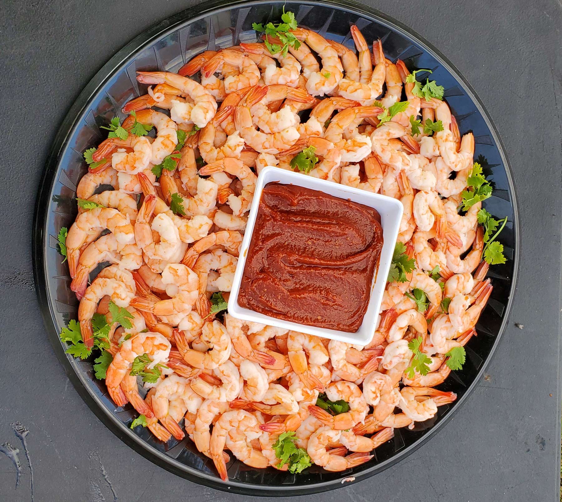 shrimp on platter with cocktail sauce